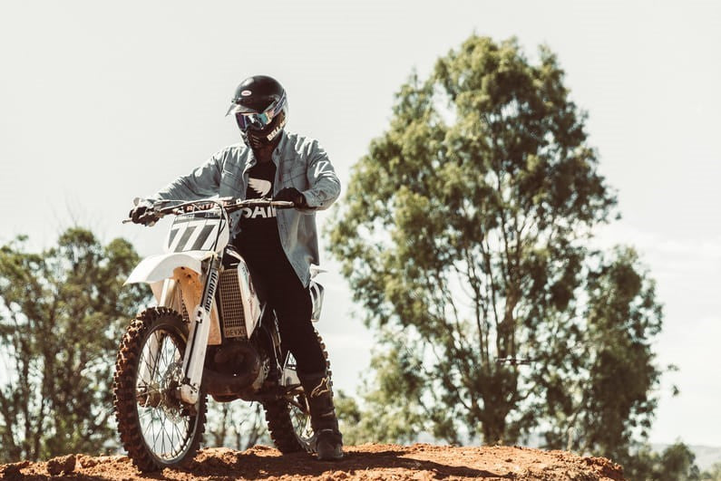 man shifting gears on a motorcycle