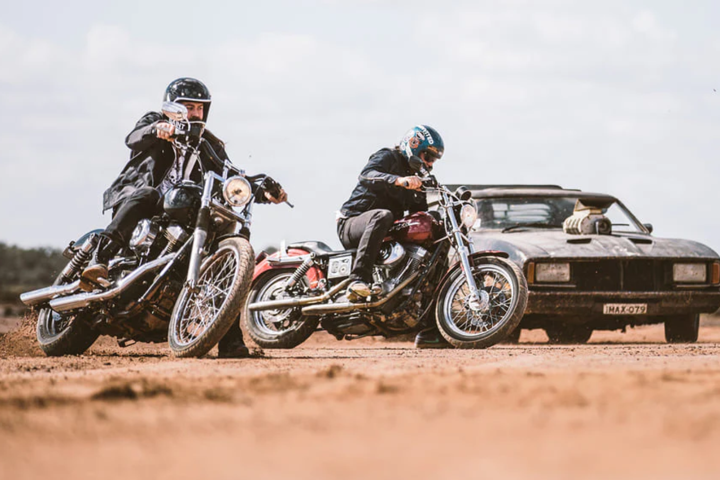 motorcycle riders riding on dirt