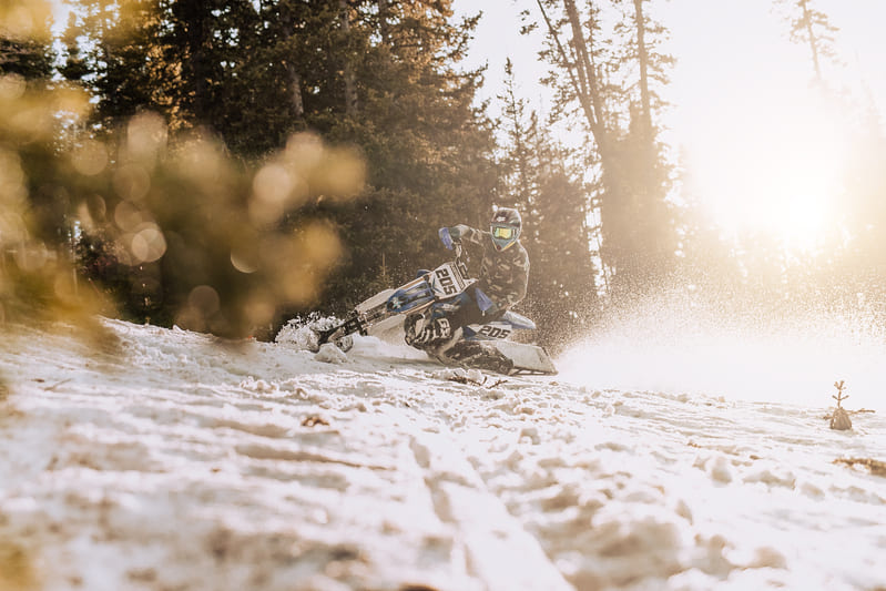 riding a motorcycle on snow